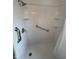 White shower with grab bar and shelving at , Beech Grove, IN 46107
