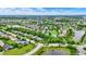Beautiful aerial view of a residential neighborhood featuring tree-lined streets, ponds, and well-kept homes at 2535 Dawn Ridge Dr, Westfield, IN 46074