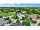 Aerial view of a neighborhood showcasing a two-story home with landscaped yards and mature trees at 2535 Dawn Ridge Dr, Westfield, IN 46074