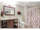 Bathroom featuring a vanity with a sink and storage, a toilet, and a shower and tub combination at 2535 Dawn Ridge Dr, Westfield, IN 46074