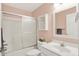 Bathroom with vanity, sink, and toilet with a tub and shower with a sliding glass door at 2535 Dawn Ridge Dr, Westfield, IN 46074