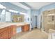 Large bathroom with double sinks, soaking tub, glass enclosed shower and natural light at 2535 Dawn Ridge Dr, Westfield, IN 46074