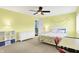 Sunlit bedroom with a ceiling fan, a work desk and views from an open doorway at 2535 Dawn Ridge Dr, Westfield, IN 46074