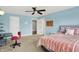 Bedroom boasts light blue walls, carpeted floors, and features bed, desk, and an ensuite bathroom at 2535 Dawn Ridge Dr, Westfield, IN 46074