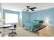 Bright bedroom featuring a ceiling fan, a work space, and large window at 2535 Dawn Ridge Dr, Westfield, IN 46074