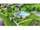 Inviting community pool area featuring a clubhouse, pool, spa, lounge chairs, and lush landscaping at 2535 Dawn Ridge Dr, Westfield, IN 46074