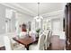 Bright dining room with hardwood floors, large windows, and a traditional dining set for formal gatherings at 2535 Dawn Ridge Dr, Westfield, IN 46074