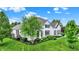 Well-maintained two-story home with lush green lawn and mature trees at 2535 Dawn Ridge Dr, Westfield, IN 46074