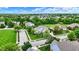 Stunning white two-story home boasts lush green landscaping and a perfectly manicured lawn at 2535 Dawn Ridge Dr, Westfield, IN 46074