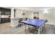 Basement game room featuring ping pong table, bar, and partial kitchen at 2535 Dawn Ridge Dr, Westfield, IN 46074