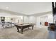 Spacious game room area with a billiards table and ping pong table at 2535 Dawn Ridge Dr, Westfield, IN 46074