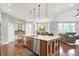 Open kitchen design with island seating seamlessly connects to dining and living areas, great for entertaining at 2535 Dawn Ridge Dr, Westfield, IN 46074
