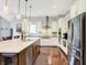 Bright, modern kitchen featuring stainless steel appliances, a center island, and sleek cabinetry at 2535 Dawn Ridge Dr, Westfield, IN 46074