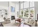 Bright living room features a fireplace, built-in shelves, and large windows overlooking the backyard at 2535 Dawn Ridge Dr, Westfield, IN 46074
