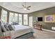 Large main bedroom with abundant natural light, TV, and seating area at 2535 Dawn Ridge Dr, Westfield, IN 46074