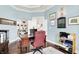 Cozy home office with built-in shelves, hardwood floors, and a comfortable desk and chair setup at 2535 Dawn Ridge Dr, Westfield, IN 46074