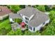 Aerial view showcasing a backyard with a stone patio, pergola, and lush landscaping at 2535 Dawn Ridge Dr, Westfield, IN 46074