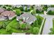 Aerial view of a two-story home with white siding, well-kept landscaping, and a basketball court at 2535 Dawn Ridge Dr, Westfield, IN 46074