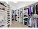 This walk-in closet has built in shelving and racks for storage and organization at 2535 Dawn Ridge Dr, Westfield, IN 46074