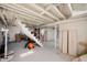 Unfinished basement with painted ceilings, concrete floors, and exposed beams, great for storage at 2715 Northview Ave, Indianapolis, IN 46220