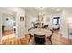 Dining room features a round wooden table, with views into the kitchen and bedroom at 2715 Northview Ave, Indianapolis, IN 46220