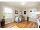 Inviting living room featuring hardwood floors, neutral walls, and natural light from two windows at 2715 Northview Ave, Indianapolis, IN 46220