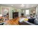 Living room with hardwood floors, a fireplace, and plenty of natural light at 2715 Northview Ave, Indianapolis, IN 46220