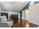 Bedroom with high angled ceilings, hardwood floors, and a gray upholstered chair at 28 N Elizabeth St, Indianapolis, IN 46219