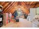 Spacious attic with exposed wooden beams, storage and a window at 3295 Allison Ct, Carmel, IN 46033
