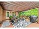 A covered deck featuring outdoor furniture and grill offers a relaxing outdoor space for entertaining at 3295 Allison Ct, Carmel, IN 46033