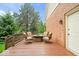 A wooden deck with a fire pit and seating area offers a great outdoor space for relaxation and socializing at 3295 Allison Ct, Carmel, IN 46033