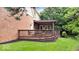 The back deck featuring brick house offers an outdoor gathering space with comfortable seating and views of the lawn at 3295 Allison Ct, Carmel, IN 46033