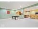 A spacious basement featuring a pool table, bar, and open layout offers a versatile entertainment space at 3295 Allison Ct, Carmel, IN 46033