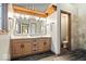 Bathroom showcasing double sinks, wood cabinets, elegant countertops, and tile shower at 3295 Allison Ct, Carmel, IN 46033