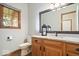 Bathroom features a marble vanity, wooden cabinet, and stylish mirror at 3295 Allison Ct, Carmel, IN 46033