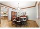 Elegant dining room features a chandelier, wood floors, and classic details at 3295 Allison Ct, Carmel, IN 46033