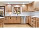 Well-appointed kitchen featuring stainless steel appliances, custom cabinetry, and granite countertops at 3295 Allison Ct, Carmel, IN 46033