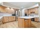 Spacious kitchen with an island, stainless steel appliances, and custom wood cabinets at 3295 Allison Ct, Carmel, IN 46033
