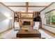 Cozy living room with brick fireplace, built-in cabinets, and bright natural light at 3295 Allison Ct, Carmel, IN 46033