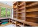 Functional office space with built-in shelving and views of the outdoors at 3295 Allison Ct, Carmel, IN 46033
