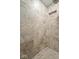 Tiled shower features a built-in niche and neutral stone accents at 3295 Allison Ct, Carmel, IN 46033