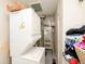 Compact laundry area with stacked washer and dryer, and a utility sink at 3338 Orchard Ave, Indianapolis, IN 46218