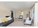 Bright living room with carpeted floors, comfortable furnishings, and ample natural light at 3338 Orchard Ave, Indianapolis, IN 46218