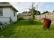 Backyard featuring a lush green lawn, and a chain link fence at 341 Barton Ave, Indianapolis, IN 46241