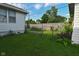 Backyard featuring a lush green lawn, and a chain link fence at 341 Barton Ave, Indianapolis, IN 46241