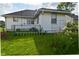Backyard featuring a lush green lawn, and a chain link fence at 341 Barton Ave, Indianapolis, IN 46241