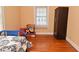 Bedroom features a closet, hardwood flooring and a window at 341 Barton Ave, Indianapolis, IN 46241