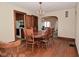 Spacious dining room includes hardwood floors, vintage chandelier, and classic wooden furniture at 341 Barton Ave, Indianapolis, IN 46241