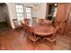 Charming dining room with a hardwood floor, wooden table and chairs, and a chandelier at 341 Barton Ave, Indianapolis, IN 46241