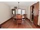 The dining room features a wood table set, hardwood floors, and a chandelier at 341 Barton Ave, Indianapolis, IN 46241